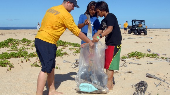 110915-N-YU572-076
BARKING SANDS, Hawaii (Sept. 15, 2011) Aviation Maintenance Administrationman 2nd Class Devon Brandenburg and student volunteers collect trash along a beach at the Pacific Missile Range Facility. More than 40 Sailors and volunteers teamed up with 16 students and faculty of Ke Kula Ni`ihau O Kekaha School to collect trash along the shore at the Pacific Missile Range Facility. The beach cleanup effort was in observance of International Coastal Cleanup Day sponsored by the Ocean Conservancy. (U.S. Navy photo by Mass Communication Specialist 1st Class Jay C. Pugh/Released)